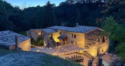 Old mill nestled in greenery in Drôme Provençale, hidden from view