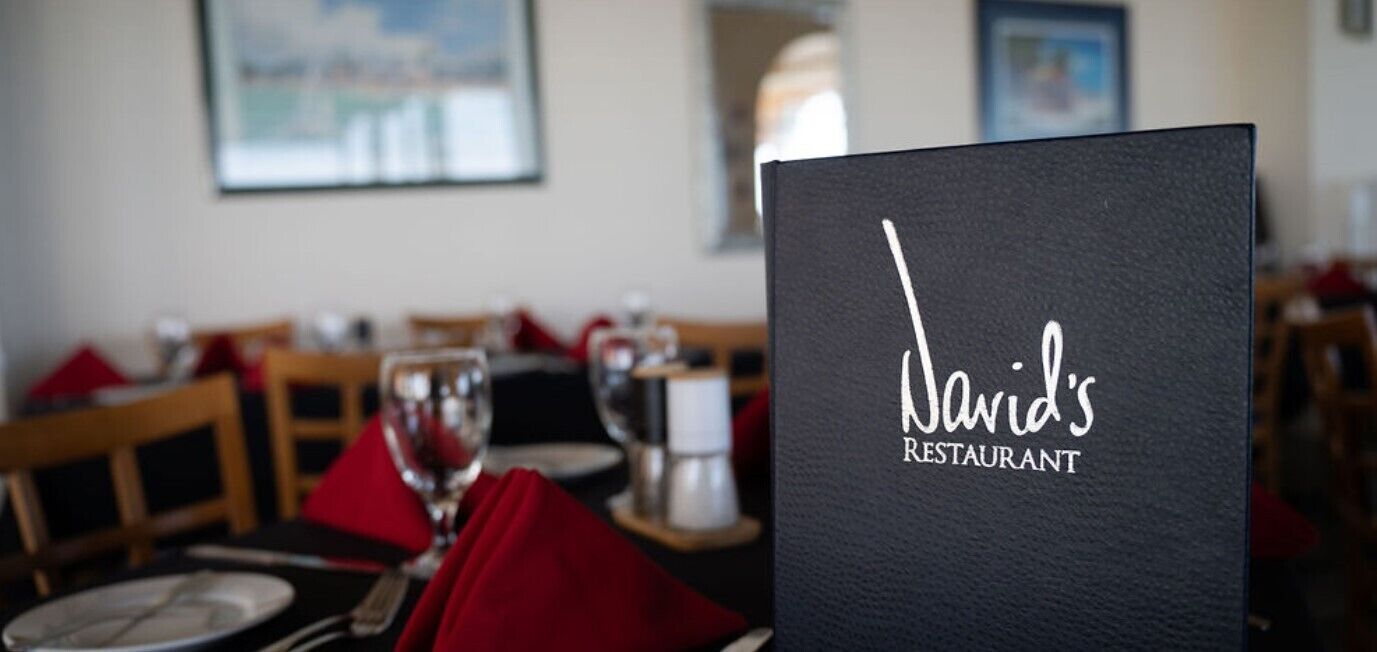 A restaurant menu with the name "Nawid's Restaurant" on a black background.