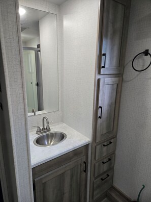 Shower, towels, soap, toilet paper