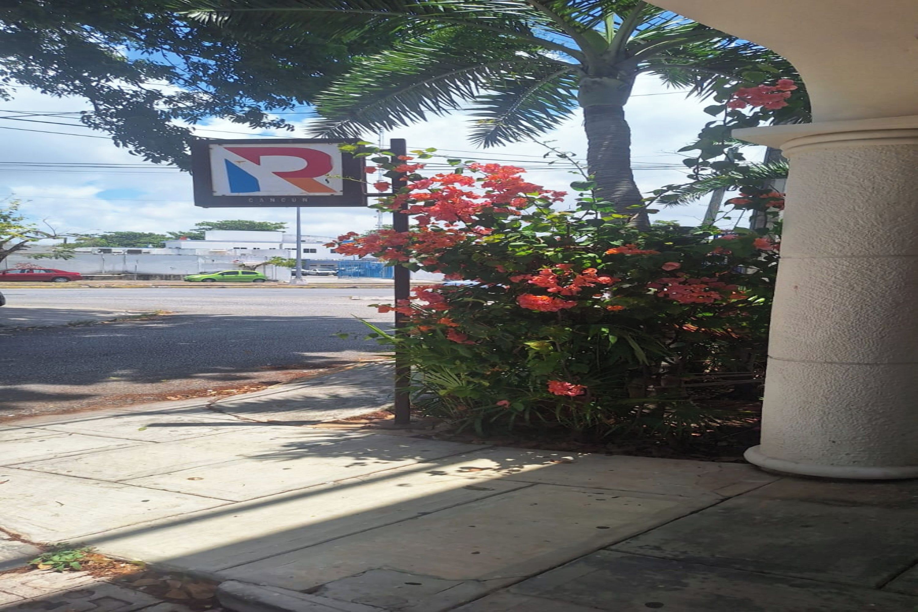 A parking sign with a 'P' and 'R' indicating parking and a restaurant.