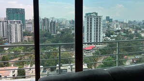 A cityscape view from a high-rise building with multiple balconies and a clear sky. - Delightful 3-bedroom apartment with best view in Addis Ababa (Addis Ababa)