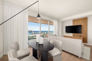 11 Aurora Sky Suite | Living area | 65-inch Smart TV with digital channels, books - ONE GT Grand Cayman (George Town)