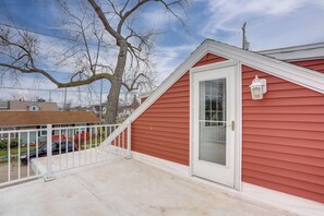 A red house with a white door and a small porch. - 1 Block to Beach: Home w/ Hot Tub in Port Clinton! (Port Clinton)
