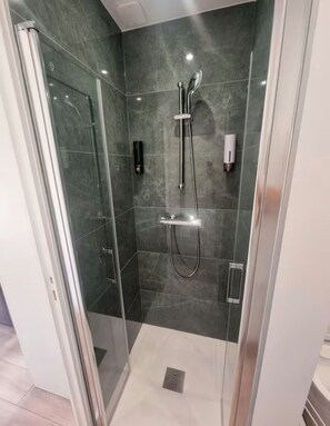 Shower, hair dryer, towels, soap