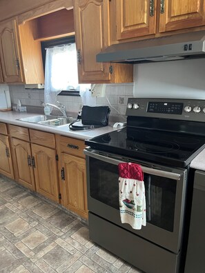 Private kitchen - Private two bedroom home near Summerside with office; AC; fireplace; TV; wifi (Summerside)
