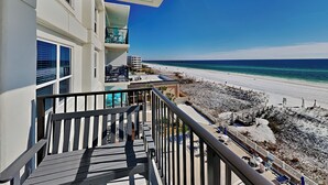 A balcony with a view of a beach and ocean. - Sea Oats #603 by Southern Vacation Rentals (Fort Walton Beach)