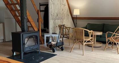 Between land and sea, an unusual wood-frame cottage with A-shaped architecture