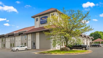 A hotel with a sign reading "Baymont Inn & Suites by Wyndham".