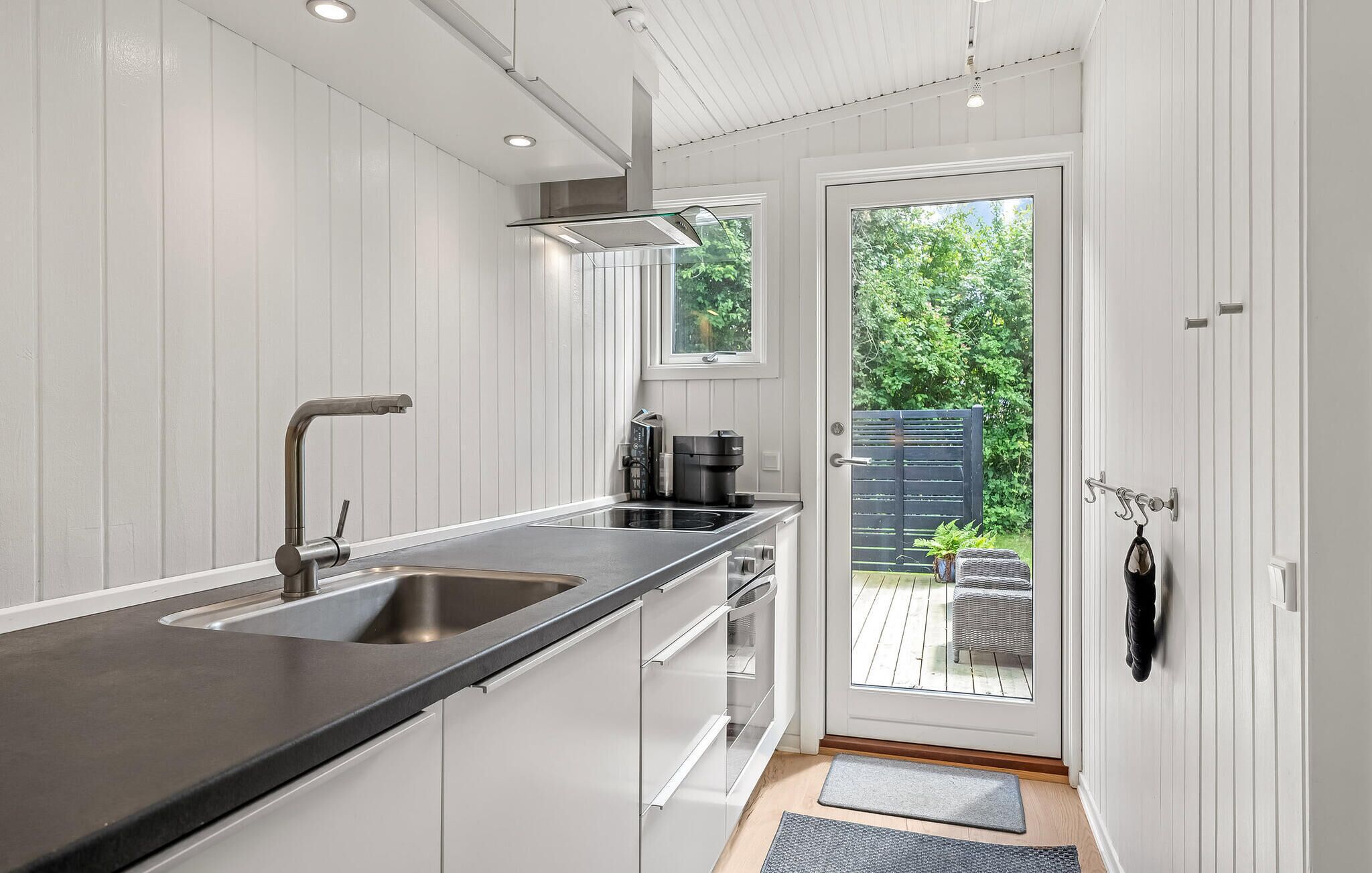 Fridge, stovetop, dishwasher, coffee/tea maker