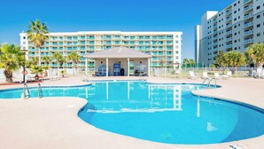 A hotel with a swimming pool, a covered seating area, and a multi-story building with balconies. - Gulf Shores Plantation #4206 by Southern Vacation Rentals (Gulf Shores)