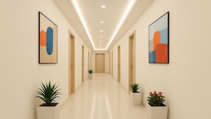 A hallway with a modern design, featuring a long corridor with doors on both sides, potted plants, and abstract artwork on the walls.