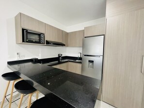 Fridge, stovetop, coffee/tea maker, toaster