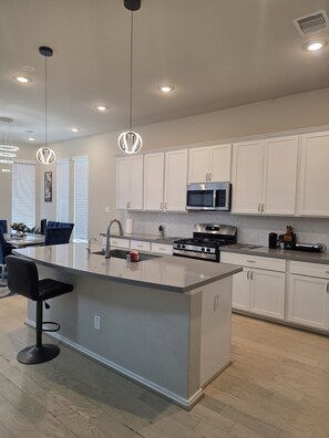 Fridge, microwave, oven, stovetop - Family-Friendly 5BR Home, Game Room + Large Backyard! with AC, WiFi in 77407 (Richmond)