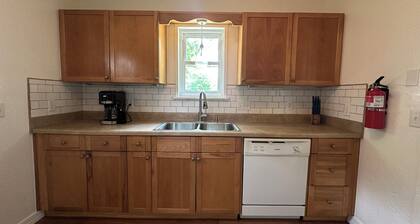 Cozy and charming 2-bedroom house in Norman with EV charger. Close to downtown.