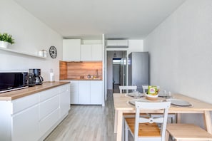 Fridge, microwave, stovetop, coffee/tea maker