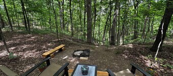 Charming A-frame cabin set in the woods overlooking deep wooded ravines.