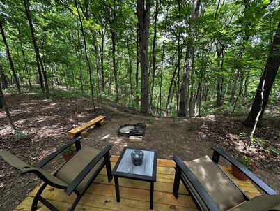 Charming A-frame cabin set in the woods overlooking deep wooded ravines.