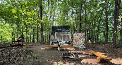 Charming A-frame cabin set in the woods overlooking deep wooded ravines.
