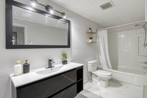 Hair dryer, towels, soap, toilet paper