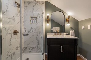 Shower, hair dryer, towels, soap
