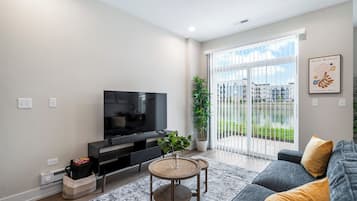 Family Apartment, Pets Allowed, Lake View | Living area | 55-inch TV with digital channels, streaming services