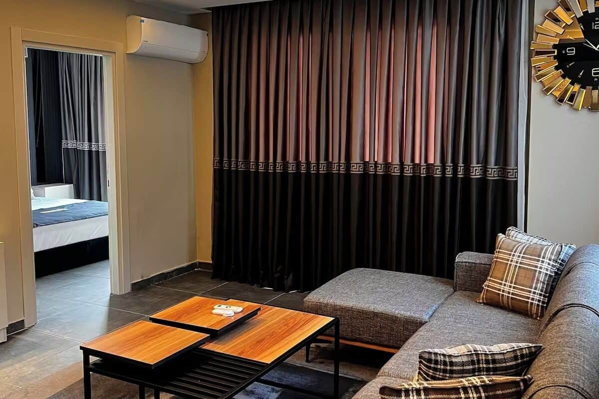 Family Suite, 1 Queen Bed with Sofa bed, Balcony, City View | Living area | 64-inch TV with digital channels, fireplace