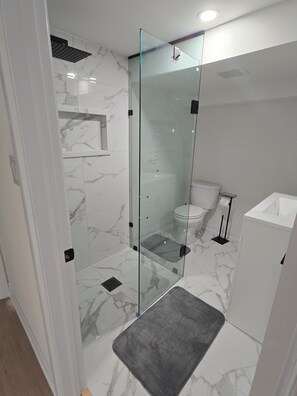 Shower, hair dryer, towels, soap
