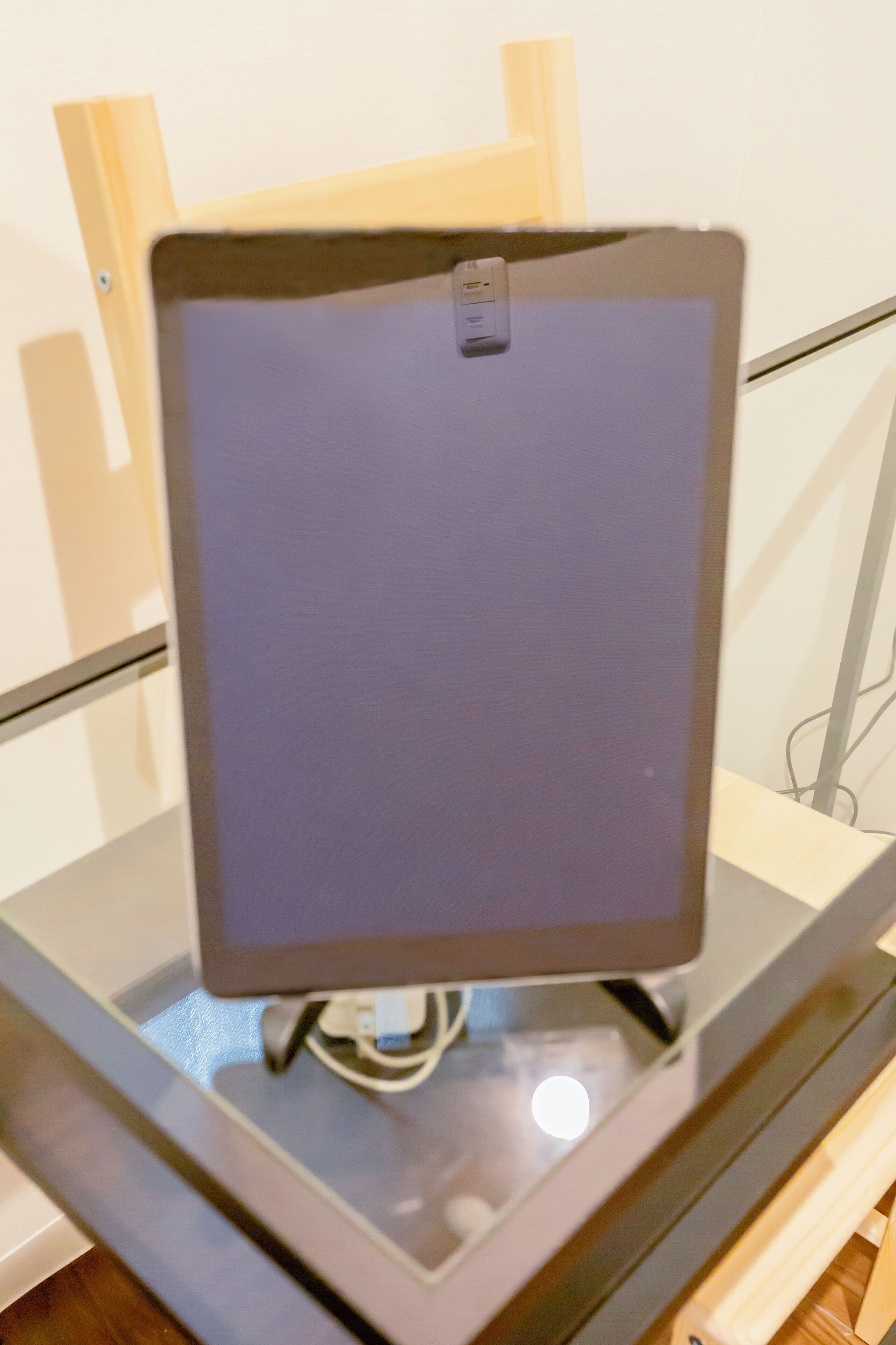 A computer monitor on a stand.