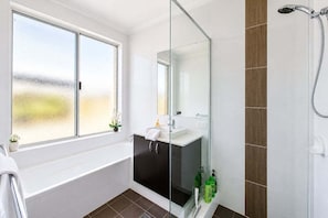 Shower, hair dryer, towels, soap