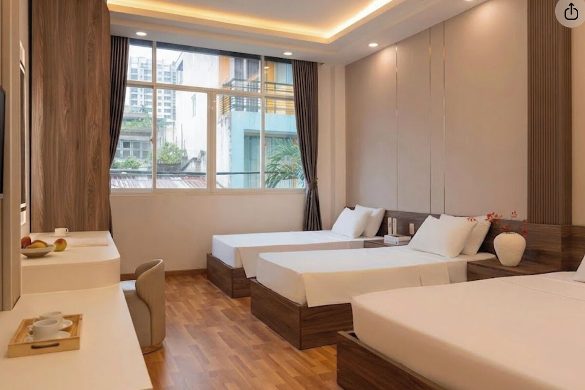 Deluxe Room, City View | Minibar, desk, laptop workspace, iron/ironing board