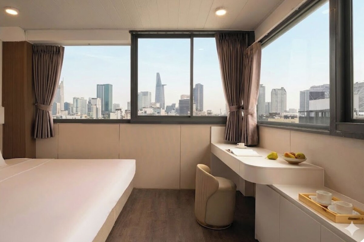 Comfort Room, City View | Minibar, desk, laptop workspace, iron/ironing board