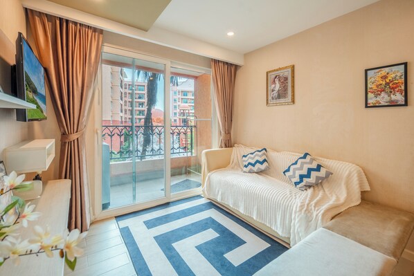 Classic Apartment, 1 King Bed with Sofa bed, Balcony, Courtyard View | Living area | Flat-screen TV