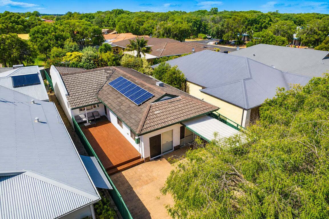 Sunny suburban home with solar panels