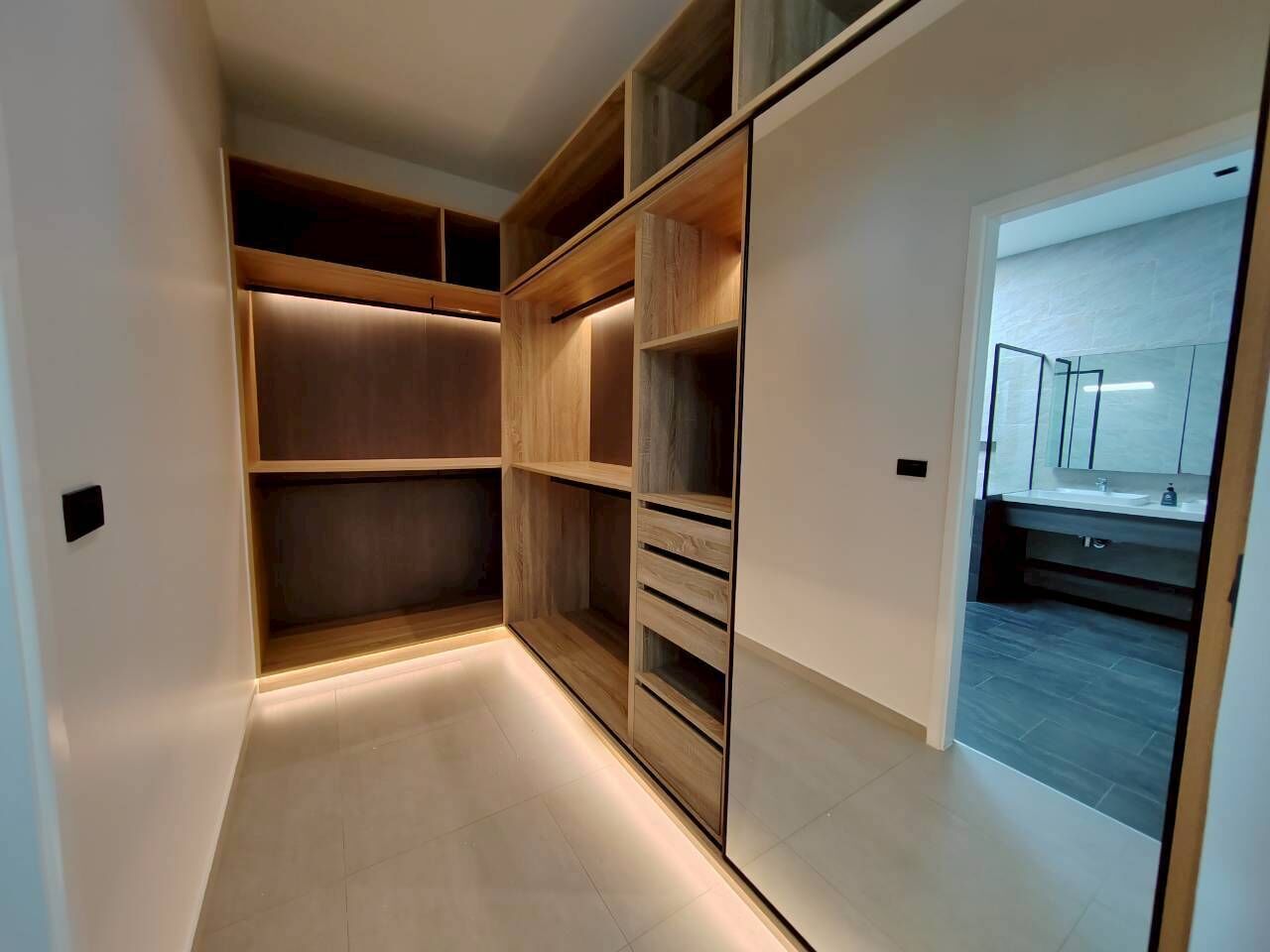 A modern kitchen with a built-in oven and a countertop.