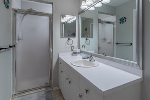 Shower, hair dryer, towels, soap