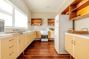 Two-Bedroom House, Sleeps 4, 1 Queen and 2 Single Beds | Private kitchen | Full-size fridge, microwave, electric kettle