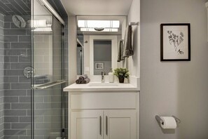 Shower, hair dryer, towels, shampoo