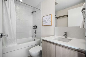 Shower, hair dryer, towels - Getaway 2BR Suite w/ Views | Steps to Stampede Park (Calgary)