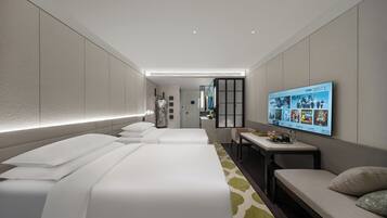 Deluxe Twin kamer, uitzicht op de stad | Luxe beddengoed, donsdekens, een minibar, een kluis op de kamer