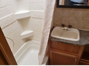 Shower, towels, soap, toilet paper