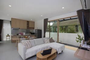 Design Villa, 2 Bedrooms, Pool View | Living area | 36-cm flat-screen TV with cable channels - Tropical Life at Seamate 2BR Pool Villa (Chalong)