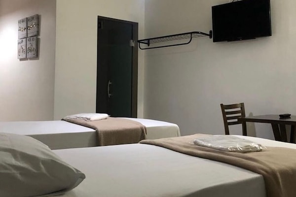 Twin Room, City View | Desk, laptop workspace, blackout drapes, iron/ironing board