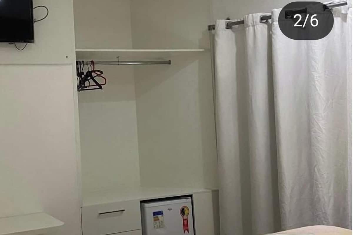 Desk, laptop workspace, blackout curtains, iron/ironing board