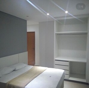Desk, laptop workspace, blackout curtains, iron/ironing board