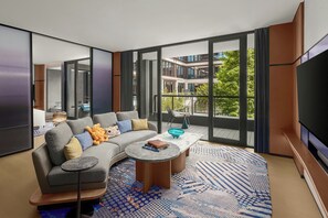 Suite, 1 King Bed, Balcony, Garden View | Living room