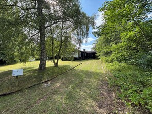 A house surrounded by trees with a grassy yard. - In beautiful Odsherred, northwest Zealand (Nykøbing Sj)