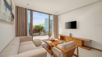 Premium Penthouse, Balcony, City View | Living area | TV