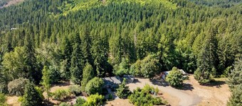 Private 6.5 acre property with private creek, EV Charger, Hot Tub, Game Room, Cottage