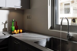 Deluxe Apartment 2 Bedroom with Terrace | Private kitchen | Full-size fridge, microwave, oven, stovetop - Regal Boutique Suites Athens (Athens)