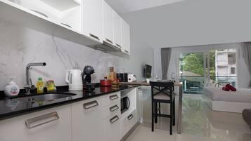 Exclusive Apartment, Balcony, Pool View | Private kitchen | Electric kettle